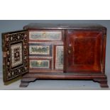 A 19th century burr yew and chequer strung table cabinet having a fitted interior with vigizapatum