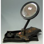 An early 20th century ebonised adjustable dressing table mirror, together with an ebonised tray,