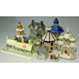 A collection of cottage ornaments to include; The Gatehouse by Coalport,