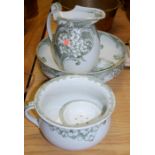 A Royal Doulton Hydrangea pattern toilet set comprising jug and bowl, chamber pot,