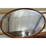 Two oval wall mirrors,