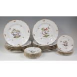 A set of twelve Herend of Hungary porcelain dinner plates and tea plates, each decorated in bright