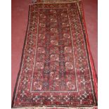 A semi-antique Persian woollen Bokhara carpet,