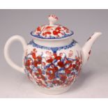 An 18th century Lowestoft porcelain teapot and cover, of bullet shape, underglaze blue and white