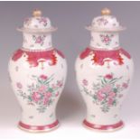 A pair of circa 1900 famille rose porcelain vases and covers, probably Samson,