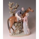 A substantial Lladro porcelain figure group, modelled as a jockey and lady, No.5036, raised on