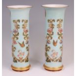 A pair of circa 1900 Limoges porcelain cylindrical vases, each decorated in gilt and bright