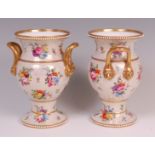 A pair of early 19th century Spode porcelain pedestal vases, each having twin applied lion mask