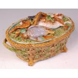 A Victorian Minton Majolica oval game pie tureen and cover, the basketwork moulded base with