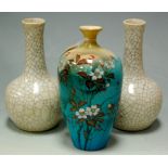 A pair of crackle glaze bottle vases, 20cm high; together with a Japanese vase (3)  Condition Report