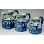 A graduated set of three reproduction Staffordshire style blue and white jugs