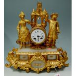 A late 19th century French gilt metal mantel clock, surmounted by a cavalier and a lady,