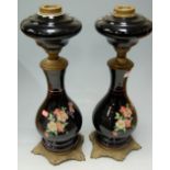 A pair of early 20th century pedestal oil lamp bases,