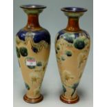 A pair of Doulton Lambeth Slaters patent vases, each of slender baluster form with impressed mark