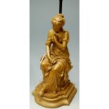 An early 20th century and later gilt painted figural table lamp base