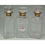 A pair of cut glass decanters and stoppers,