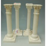 Two pairs of creamware Corinthian column candlesticks