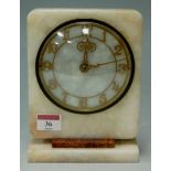 An Art Deco marble mantel clock of plain rectangular form