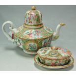 A late 19th century Canton porcelain famille rose teapot and cover, together with a similarly