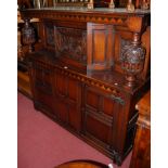 A good 17th century style joined oak court cupboard of large proportions,