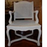 A French Louis XV style white painted and cane inset open armchair