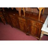 A Bevan Funnell mahogany and flame mahogany breakfront sideboard of good size