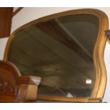 A Victorian re-gilded shaped overmantel mirror