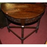 An early 20th century barley twist oak demi-lune side table,