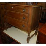 An early 20th century oak swing mirror back dressing chest