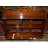 An ***ARTHUR BRETT*** mahogany three tier hanging wall shelf,