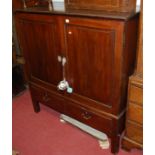 A George III and later adapted mahogany double door side cupboard,