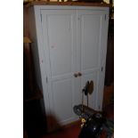 A modern pine and part white painted double door wardrobe