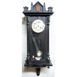 A circa 1900 Vienna stained wood drop trunk wall clock,