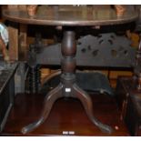 A George III oak tilt top tripod table