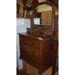 An Edwardian oak swing mirror backed three drawer dressing chest