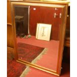 A modern gilt and silvered bevelled rectangular wall mirror