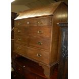 A 19th century oak slope front four drawer writing bureau