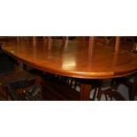 A 1970s teak dining suite comprising; extending dining table with pull-out action and fold-out leaf,