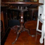 A George III mahogany birdcage tilt top tripod table