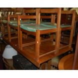 A 1970s teak dining suite comprising;