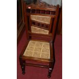 A hardwood and cane seat side chair