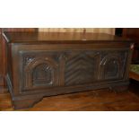 A moulded oak hinge top blanket box