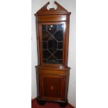 An Edwardian walnut and satinwood inlaid corner cupboard,