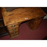 An early 20th century stained pine clerk's desk,