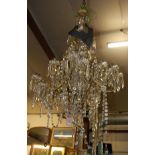 A circa 1900 Swedish gilt metal and cut crystal glass hanging multiple light chandelier