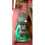 A John Deere petrol driven lawnmower,