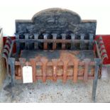 A black painted wrought iron fire basket, with inset grate,