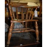 An early 20th century elm seat and fruitwood captain's chair