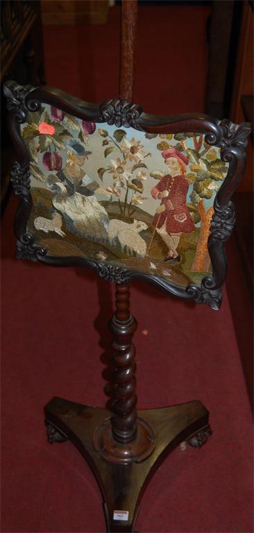 An early Victorian rosewood tapestry embroidered polescreen