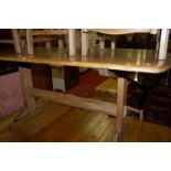 An Ercol mid-elm dining suite comprising;